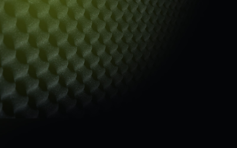 A black and green background with some shapes