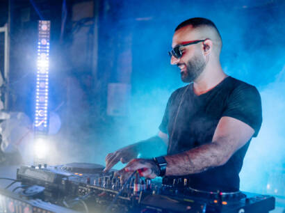 A man in black shirt playing a dj.