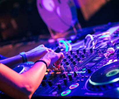 A person is playing some music on the dj equipment.