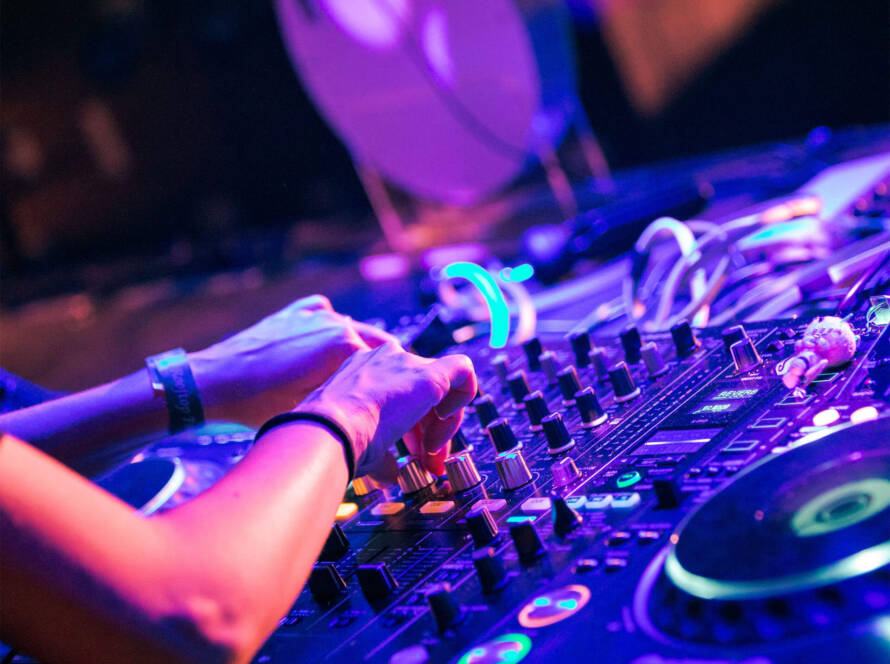 A person is playing some music on the dj equipment.